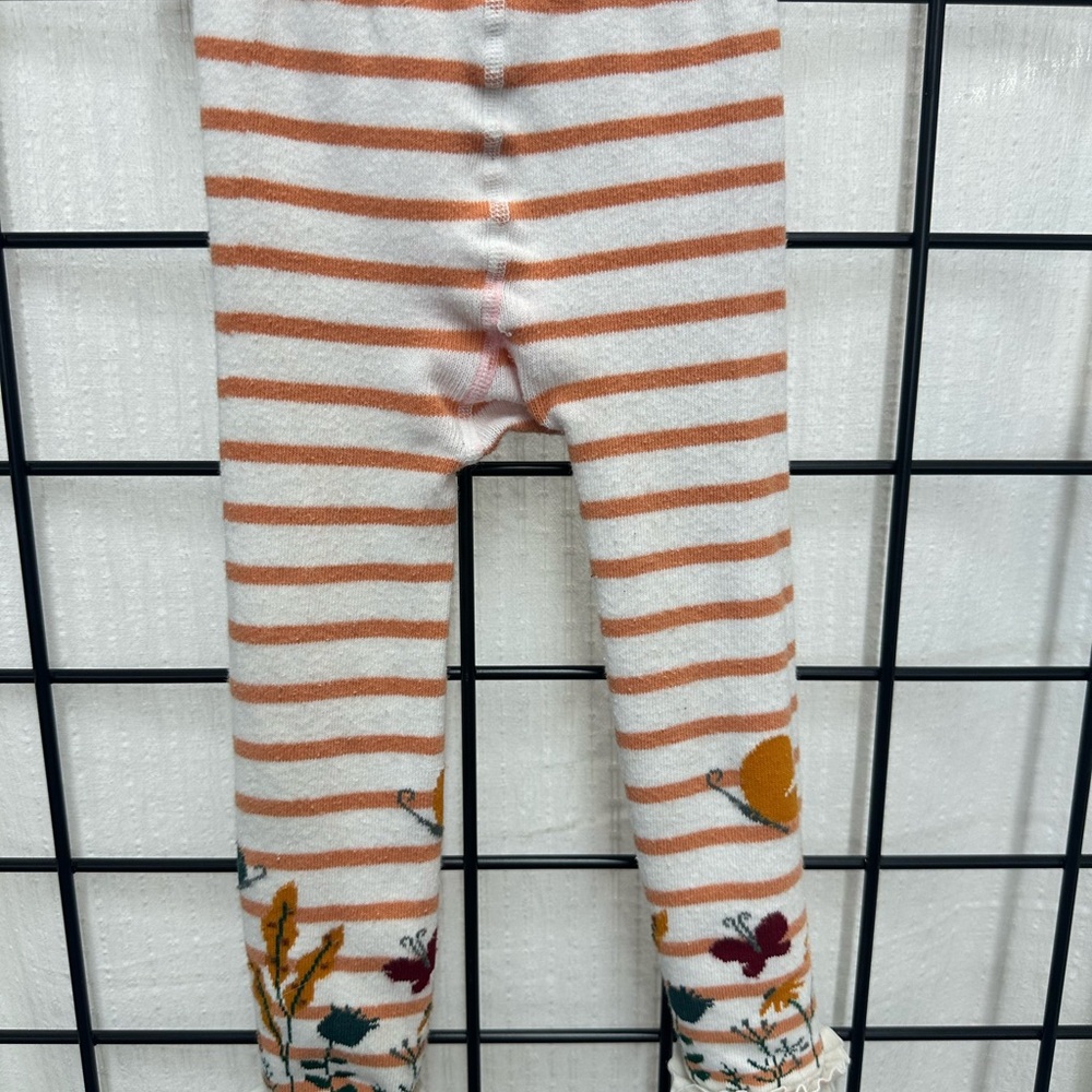 Ruffle Butts Orange and White Striped Leggings with Whimsical Details
